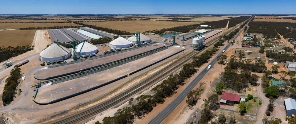 Aerial panoramic view of Grass Patch with large grain silos near the Stock Photos