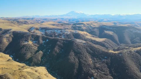 Aerial panoramic view of Gumbashi pass with distant Mount Elbrus in Caucasus Stock Footage 337023871