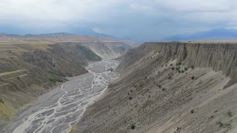 Aerial panoramic view of huge arid canyon with braided riverbed in Xinjiang Stock Footage 345520821