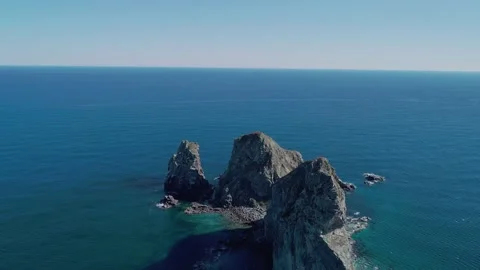 Aerial panoramic view of huge rocks at seaside and waves crashing to the coast Stock-Footage 167719355