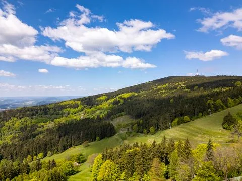 Aerial panoramic view of Jested mountain with iconic Jested Tower surrounde.. Stock Photos