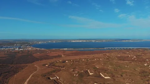 Aerial panoramic view from Kerch penisula to famous Crimean Bridge conncecting Stock Footage 105054980