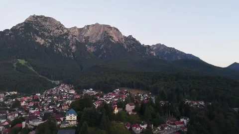 Aerial Panoramic View of Massive Mountain Ridges and Green Rural Valley Stock Footage 345494563