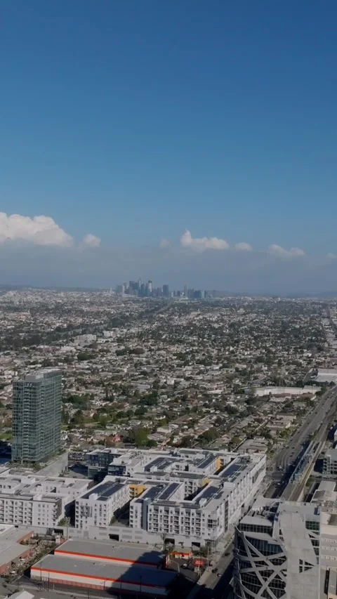 Aerial panoramic view of metropolis. Large city in flat landscape. Rows of low h Stock Footage 337413946