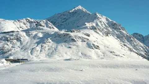 Aerial panoramic view on mountains, alpine ski resort, ski lifts or cable cars Stock Footage 228759624