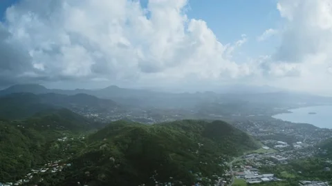 Aerial panoramic view of mountains, dense forest, city (Saint Lucia) Stock-Footage 131985255