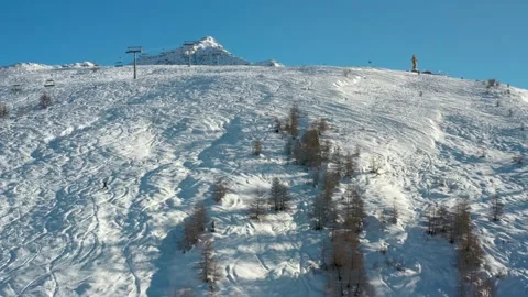 Aerial panoramic view on mountains, freeride or freestyle area, ski lifts or Stock Footage 228796772