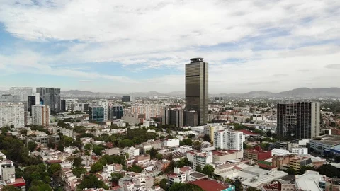 Aerial panoramic view over Anzures Neighbourhood and Torre Pemex in Mexico City Stock Footage 123947762