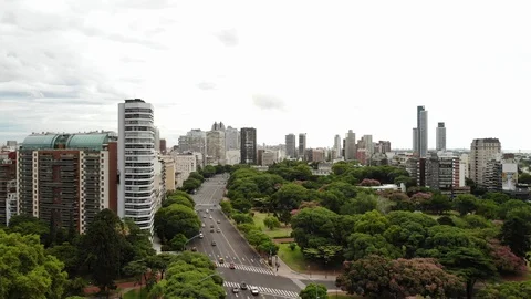 Aerial panoramic view over Avenida del Libertador, drone slowly descending with Stock Footage 126513826