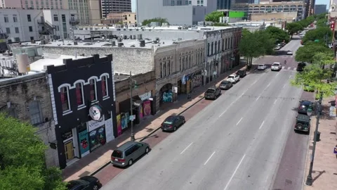 Aerial panoramic view over the dirty 6th Street Bar District Austin, Texas Stock Footage 211556792
