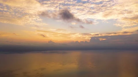 Aerial panoramic view of sunset over sea. Nothing but sky, clouds and water Stock Footage 235873060