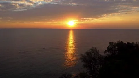 Aerial panoramic view of sunset over ocean. Nothing but sky, clouds and water Stock Footage 246894542