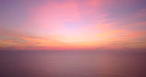 Aerial panoramic view of sunset over ocean. Colorful sky clouds water. Beautiful Stock Footage 317560247