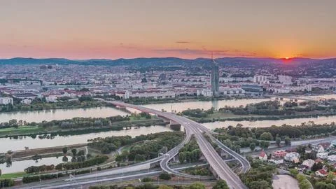 Aerial panoramic view of sunset over Vienna city with skyscrapers, highway in Fotos de archivo