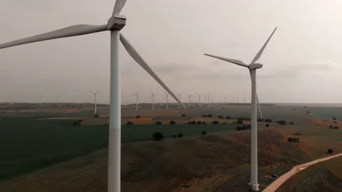 Aerial panoramic view of wind turbines and farmlands in Spain Stock Footage 150738255