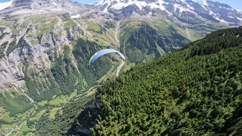 Aerial Paraglide flyby in front of Eiger and Lauterbrunnen Valley, Switzerland Stock Footage 256246712