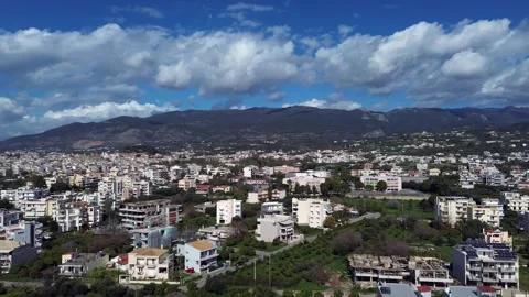 Aerial parallax view of eastern suburbs of Kalamata cityscape, with beautiful Видео 341888482