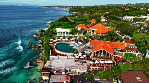 Aerial parallax view of Single Fin bar and multi level terraces on Uluwatu Stock-Footage 327616255