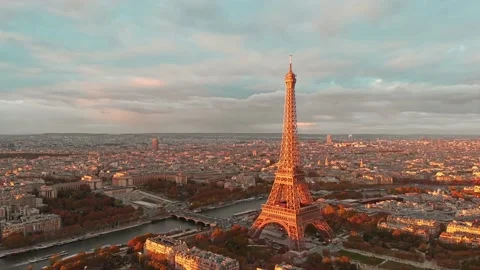 Aerial Paris close up view of Paris Tour Eiffel Tower Seine River at sunset  Stock Footage