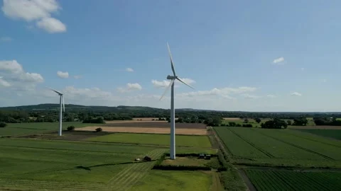 Aerial partial orbital clip of wind turbines in a small rural wind farm Stock Footage 205333653