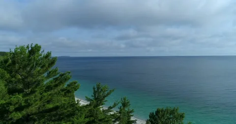Aerial Pass Pine Tree Coastline To A Pristine White Stone Beach All To Yourself Stock Footage 188006736