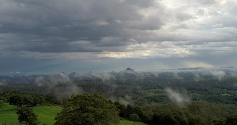 Aerial of passed thunder storm over Glasshouse Mountains,queensland,Australia Stock Footage 100309459
