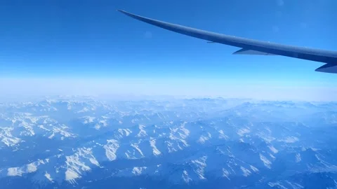 Aerial Passenger Window View Flying Over Snow-Capped European Alps Stock Footage 183398637