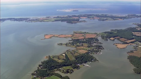 Aerial of patchwork fields amidst the inlet near the sea, Islands, Maryland Stock Footage 109129864