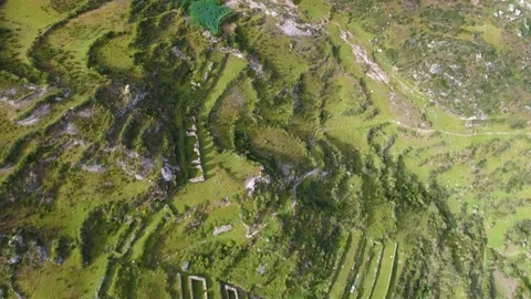 Aerial of patchwork fields on a hilly slope Stock Footage 79679319