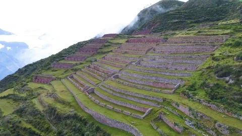 Aerial of patchwork fields on a hilly slope Stock Footage 79744243
