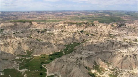 Aerial of path through mountain ridges, Badlands National Park Stock Footage 109452969