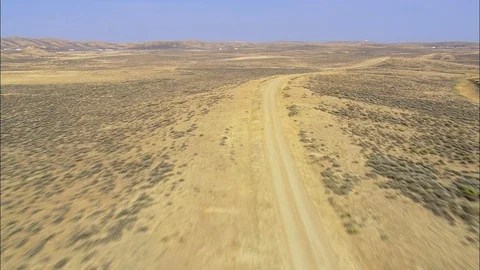 Aerial of path through rural landscape, Flight Fast And Low Along Rattlesnake Stock Footage 109471077