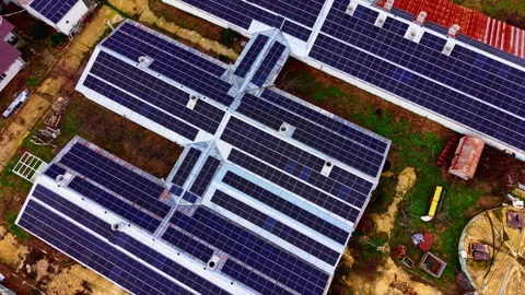 Aerial pattern of interconnected solar panel roofs, Bulgaria Stock Footage 341761547