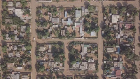 Aerial patterns of simple houses in developing suburbs of Maputo, Mozambique  Stock Footage 128058024