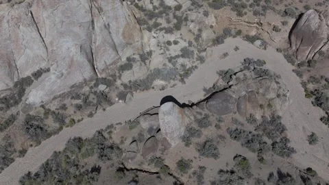 Aerial ped down focus on rocks with reveal of Mount Whitney, California on Stock Footage 277872669