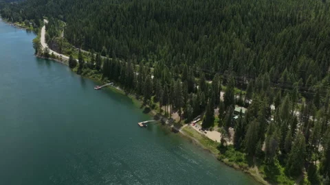 Aerial of Pend Oreille river flow through dense forest in Ruby Washington Stock Footage 337651946