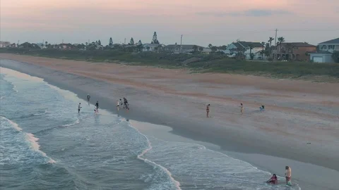 Aerial: People on the beach at sunset. Ormond Beach. Florida, USA Video stock 112899786