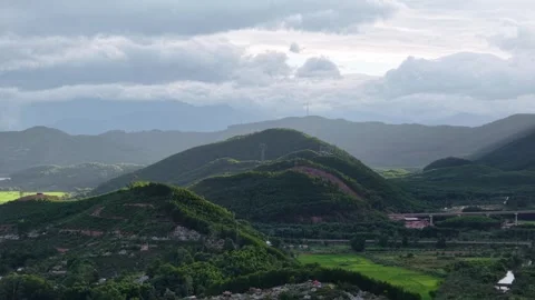 Aerial of Perfume River flowing between green hills 4K Stock Footage 339863411