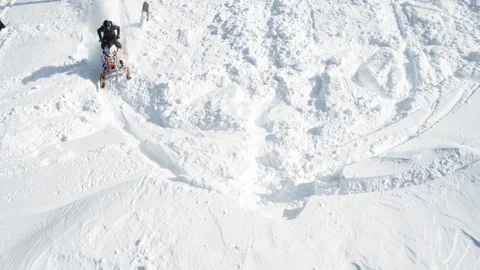 Aerial of person doing tricks while driving snow jet ski on snowy land, Montana Stock Footage 124213546