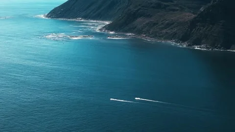 Aerial of personal watercraft wakes on deep blue water, cinematic grade Stock Footage 340554792