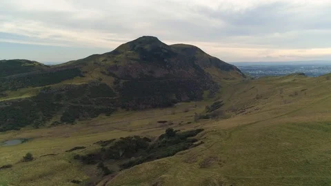 Aerial perspecive flying towards Arthurs Seat in Edinburgh, drone aerial 4K Stock Footage 101220194