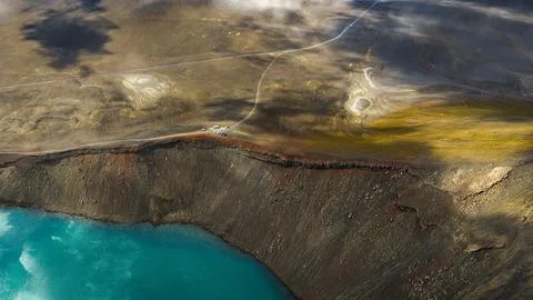 Aerial perspective of active geothermal features showing turquoise hot spring Stock Photos