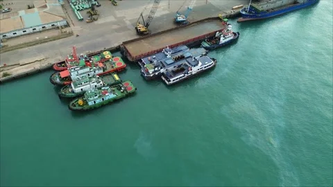 Aerial perspective of active port operations with various vessels moored at.. Video stock 339034419