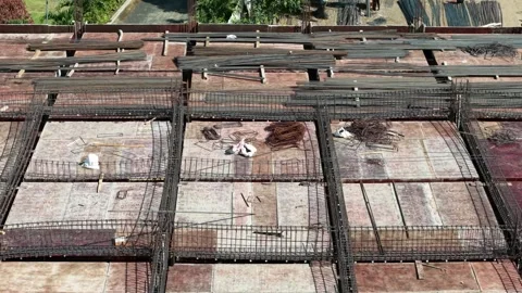 Aerial Perspective of Building Construction with Piles of Raw Materials Stock Footage 340419136