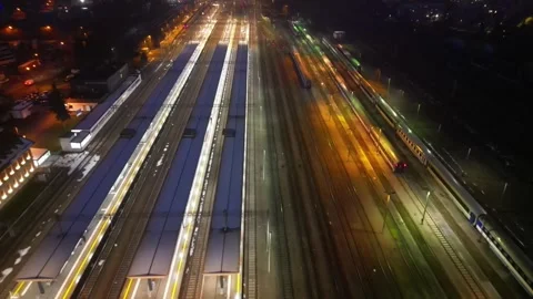 Aerial perspective of a bustling train station at night, highlighting Video stock 335887737