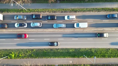 Aerial perspective captures bustling traffic on a multi-lane road Video stock 325378187