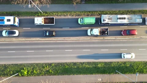 Aerial perspective captures bustling traffic on a multi-lane road, highlighting Video stock 335890797