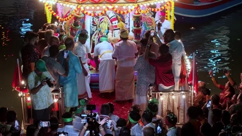 Aerial perspective captures floating chariot at Masimagam Theppa Thiruvizha Stock Footage 332095929