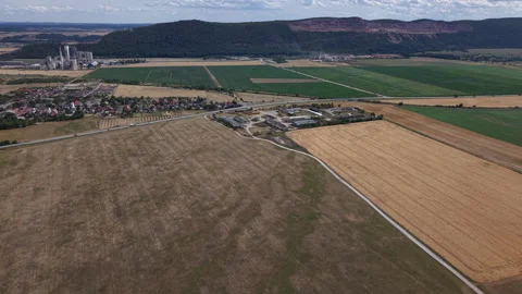 This aerial perspective captures the intersection of industrial development and Stock Footage 341398312