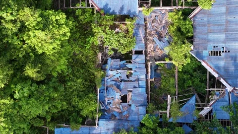 Aerial perspective captures neglected building Video stock 339860945